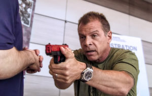 Tony Blauer holding SIRT and discussion firearm training.